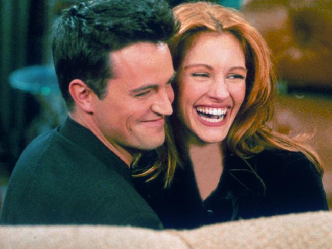 Matthew Perry and Julia Roberts hug each other on the set of Friends. Picture: Liaison.