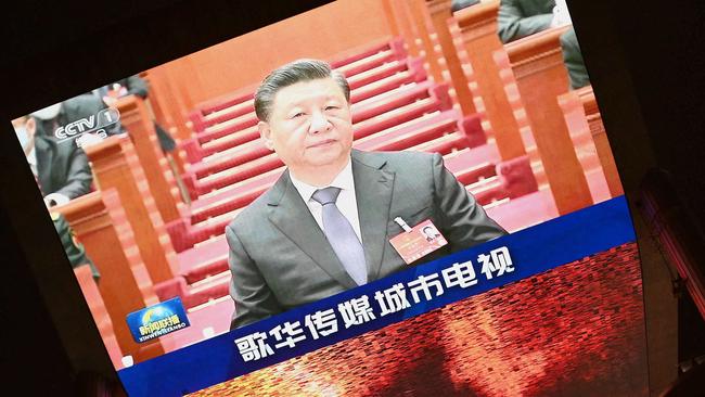 A large video screen shows Chinese President Xi Jinping at the closing session of the National People's Congress in Beijing on March 11, 2022. Picture: Noel Celis/AFP