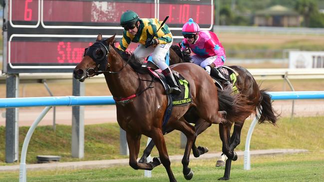 RSL Townsville 2YO Classic Race Day at Cluden Park. 'Cyclone Topgirl' riden by Nathan Day wins the classic.