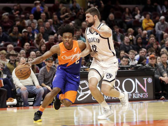 Cleveland Cavaliers' Collin Sexton drives past Brooklyn Nets' Joe Harris.