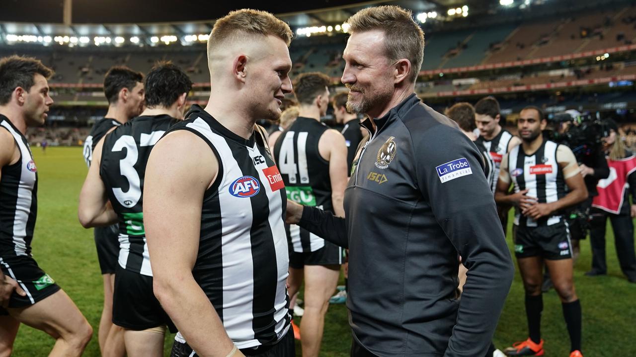 Adam Treloar of the Magpies and Nathan Buckley, coach of the Magpies talk after winning the Round 23 AFL match between the Collingwood Magpies and the Essendon Bombers at the MCG in Melbourne, Friday, August 23, 2019. (AAP Image/Scott Barbour) NO ARCHIVING, EDITORIAL USE ONLY
