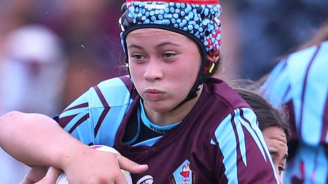 Titans Schools League at Burleigh Bears Junior Rugby League. Year 7/8 Division 1 girls:Keebra Park v Mabel Park .Keebras Okalani Compton  wrapped up in a tackle.. Picture Glenn Hampson