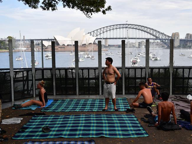 People are seen setting up at Mrs Macquarie's Point in preparation for New Years Eve Fireworks in Sydney, Monday, December 31, 2018. Picture: AAP / Brendan Esposito