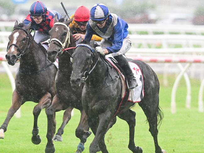 Angela Jones plows through the mud to win the Listed Gold Edition on Superalloy for trainer Rex Lipp. Picture: Grant Peters - Trackside Photography.