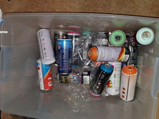 Some of the spray cans police seized at his Blue Haven address. Picture: NSW Police