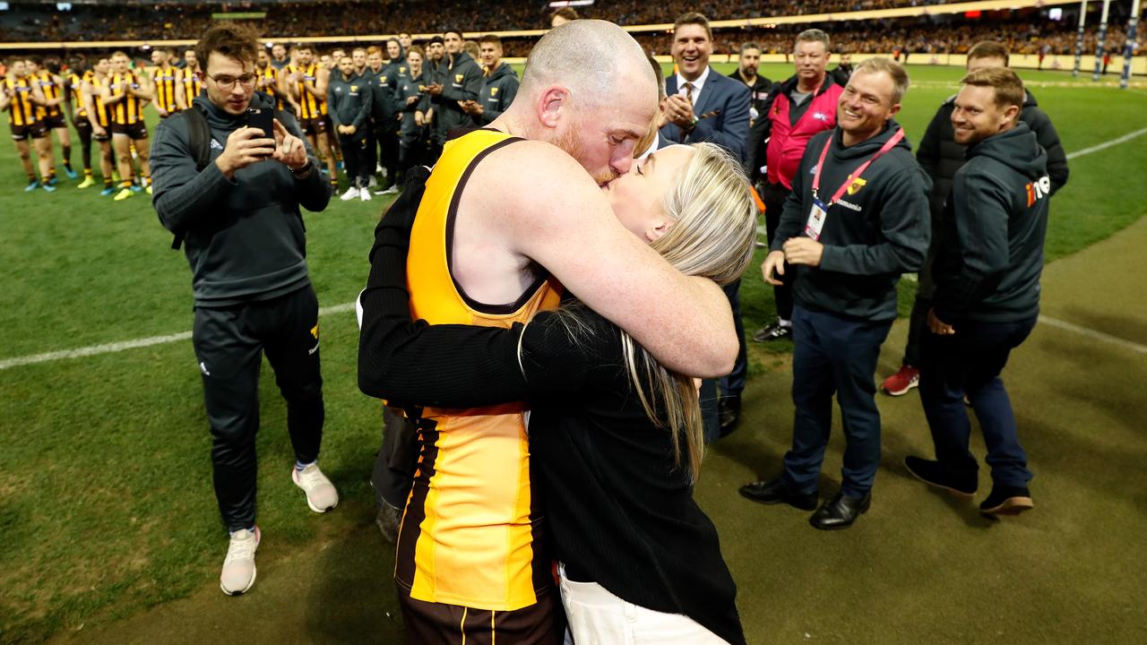 Jarryd Roughead and wife Sarah embrace Round 22’s win over Gold Coast. (Photo by Michael Willson/AFL Photos via Getty Images)