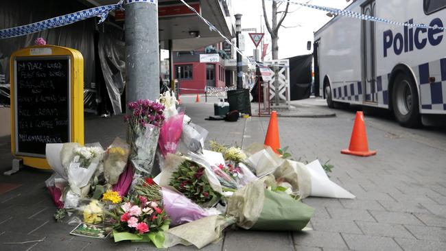 Flowers near the scene of the fatal stabbing in Elizabeth St, North Hobart. Picture: LUKE BOWDEN