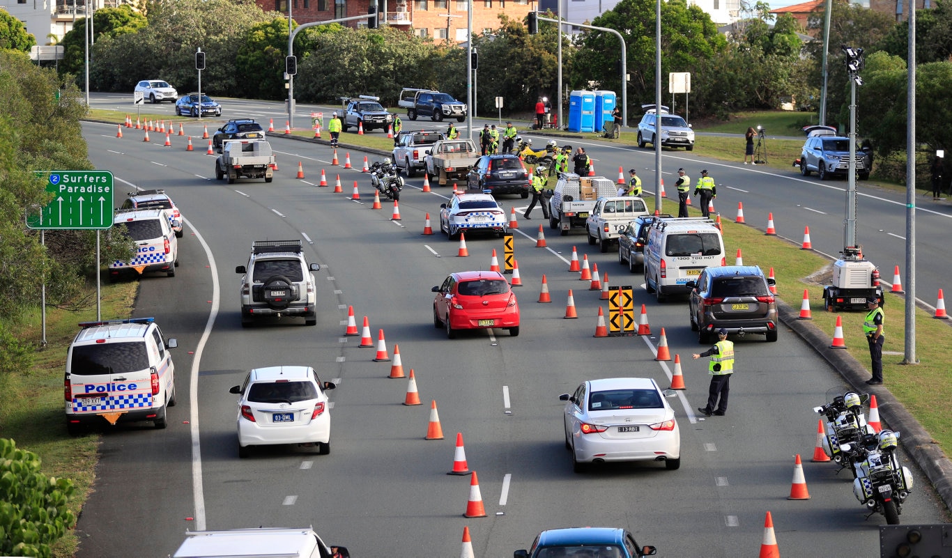 Queensland Police set up a road block due to the Corona Virus at the NSW / Queensland Border on the old Pacific Highway at Coolangatta. Photo: Scott Powick Newscorp