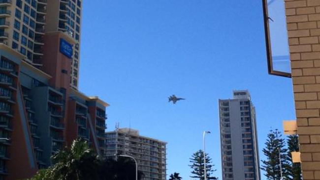 The RAAF hornet aircraft flies over the Gold Coast this morning. Picture: Debbie McLauchlin