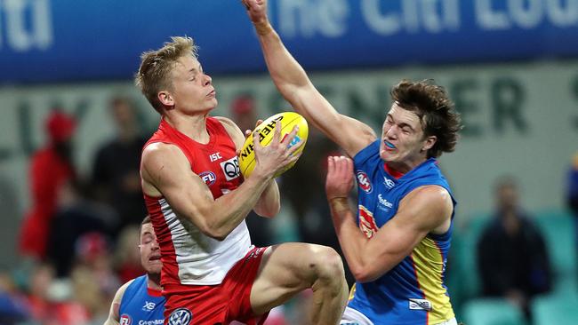 Isaac Heeney marks in front of Gold Coast’s Charlie Ballard. Picture: Phil Hillyard