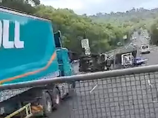 A four-wheel drive with a trailer rolled on the M1 Pacific Motorway north of Sydney causing delays. Picture by 9 News.