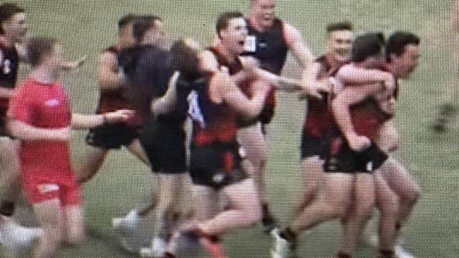 Aiden Gajanovic is mobbed by Emerald teammates after kicking the winning goal.