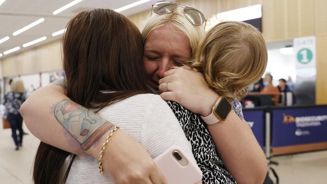 Patricia Carter is reunited with sister Jennifer Carter and niece Brianna Moore, 1 after being away for 18 months. Picture: Zak Simmonds