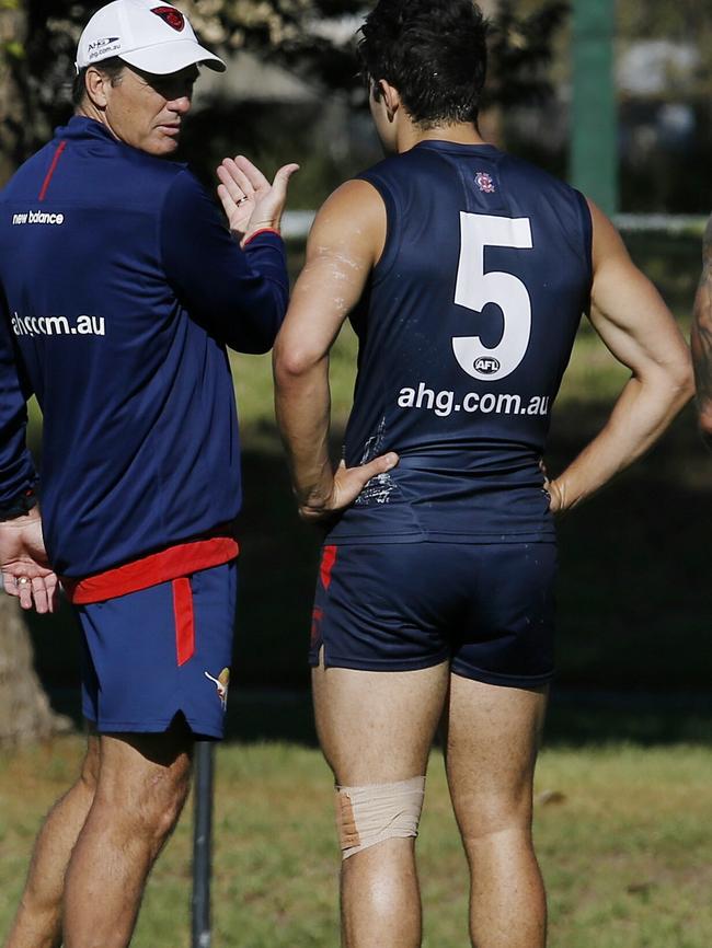 Roos speaks to Christian Petracca and his quads. Picture: Michael Klein