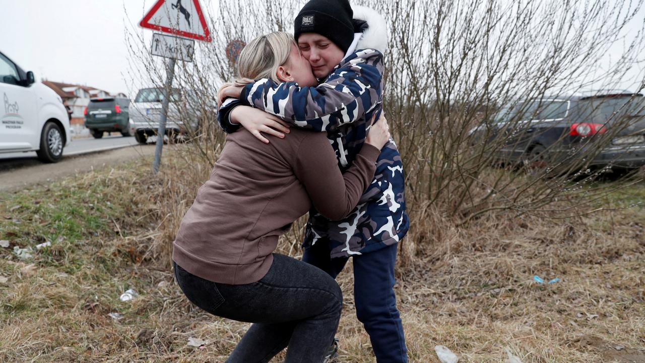 Anna Semyuk, 33, hugs her son at the Beregsurany border crossing, Hungary on February 26, 2022. Picture: Reuters/Bernadett Szabo