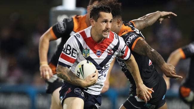 Roosters Mitchell Pearce on the way to scoring his first try during the Sydney Roosters v Wests Tigers rugby league game at Campbelltown Stadium, Sydney. Picture: Brett Costello