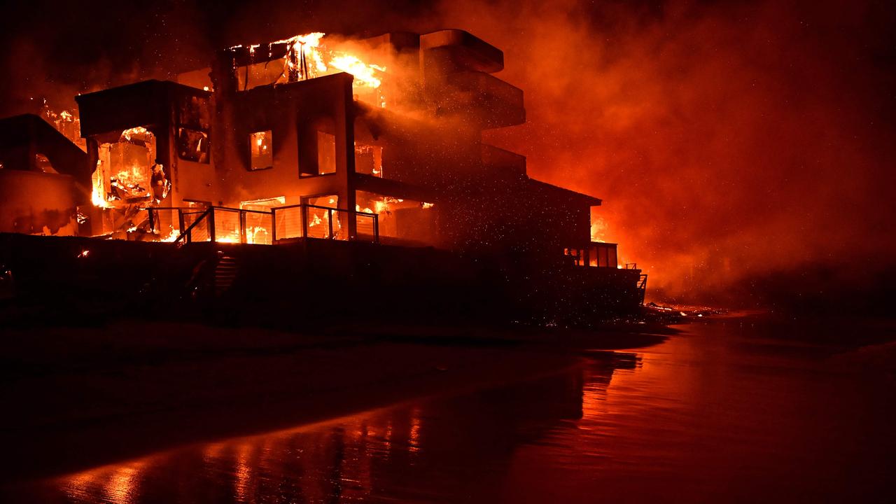 A beach house is engulfed in flames as the Palisades Fire burns. Picture: AGUSTIN PAULLIER / AFP