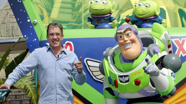 Actor comedian Tim Allen with animated film character Buzz Lightyear during the introduction for the Buzz Lightyear Astro Blasters interactive ride at Disneyland in 2005.