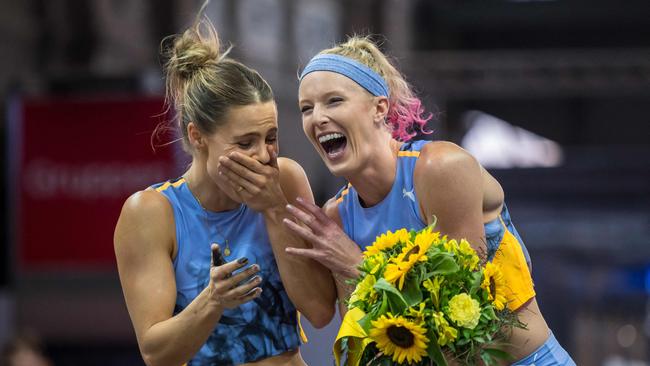 Winner Australia's Nina Kennedy (L) reacts with third-placed US' Sandi Morris during the podium ceremony. Photo by Fabrice COFFRINI / AFP.