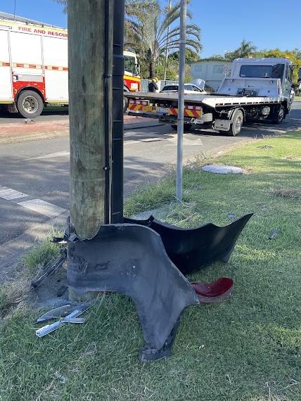 An Ergon crew was called to inspect this power pole at the scene. Picture: Zoe Devenport