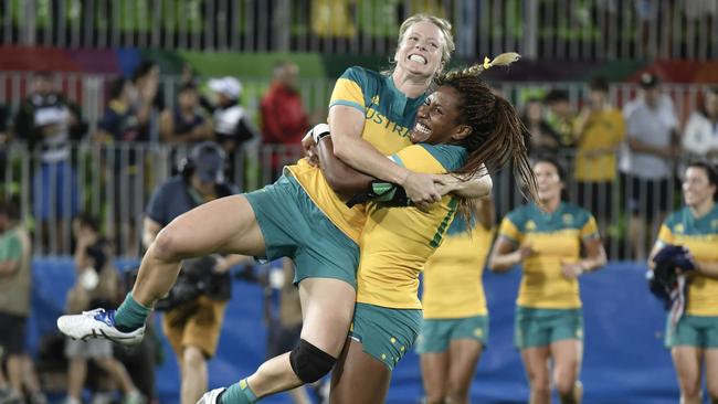 Ellia Green lifts up a teammate as they celebrate victory in the women’s Rugby Sevens gold medal match between New Zealand and Australia during the Rio 2016 Olympic Games. Picture AFP / Philippe Lopez