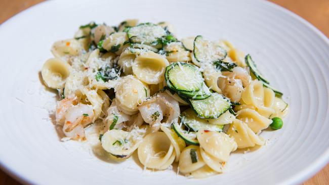 Orecchiette with wood-fired prawns, zucchini, peas, chilli, mint, lemon.