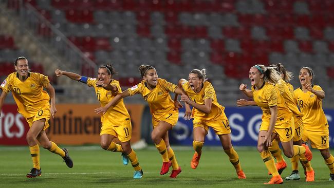 The Matildas celebrate winning their Asian Cup semi-final against Thailand.