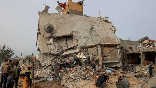 Palestinians checking the rubble following Israeli bombardment in Khan Younis in the southern Gaza Strip. Picture: AFP/Getty Images