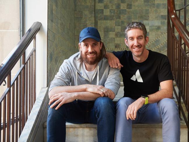 Mike Cannon-Brookes (baseball cap) and fellow founder of Atlassian, Scott Farquhar pictured together in their Sydney HQ