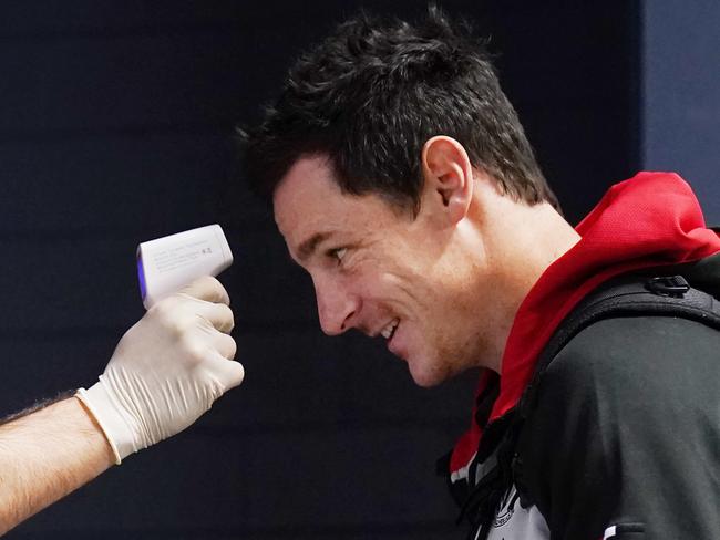 Jake Carlisle of the Saints gets his temperature tested during the Round 2 AFL match between the St Kilda Saints and the Western Bulldogs at Marvel Stadium in Melbourne, Sunday, June 14, 2020. (AAP Image/Michael Dodge) NO ARCHIVING, EDITORIAL USE ONLY