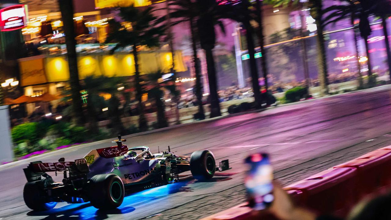 A Formula 1 racing team car from Mercedes-AMG Petronas makes a live run on the Las Vegas Strip during the Las Vegas Grand Prix Launch Party, ahead of the 2023 Inaugural Las Vegas Grand Prix, at Caesars Palace, in Las Vegas, Nevada, on November 5, 2022. - The inaugural Las Vegas F1 Grand Prix will take place November 16-18, 2023. (Photo by WADE VANDERVORT / AFP)