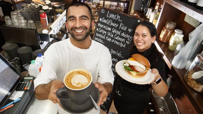 Cafe Vicolini staff, Abdullah Sajjad and Adriana Hendricks, look forward to workers coming back to the city this week. Picture: David Geraghty