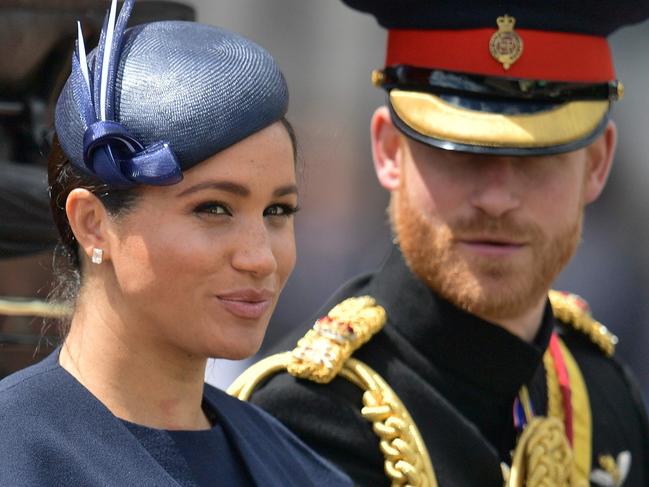 (FILES) In this file photo taken on June 08, 2019 Britain's Meghan, Duchess of Sussex (L) and Britain's Prince Harry, Duke of Sussex (R) return to Buckingham Palace after the Queen's Birthday Parade, 'Trooping the Colour', in London. - Britain's Prince Harry and his wife Meghan will give up their titles and stop receiving public funds following their decision to give up front-line royal duties, Buckingham Palace said on January 18, 2020. 