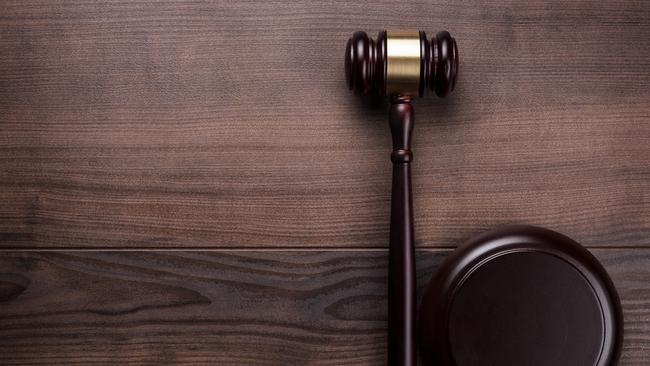 judge gavel on the brown wooden background