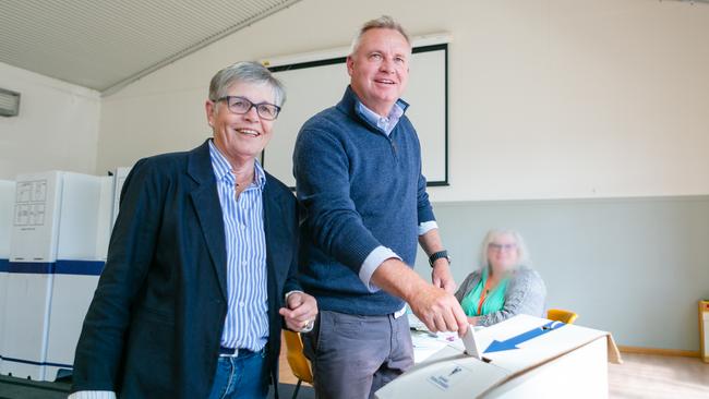 Premier Jeremy Rockliff, with his mother Gerry at his side, lodges his vote at Sassafras Primary School on Saturday, March 23, for the Tasmania State Election 2024. Picture: Patrick Gee.