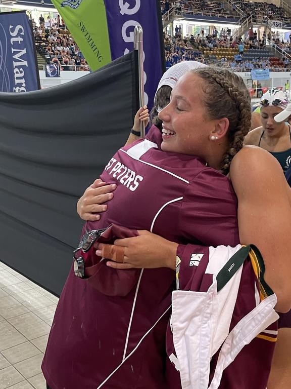 Swimmer Amelia Weber is congratulated on Wednesday night. She also features in our story.