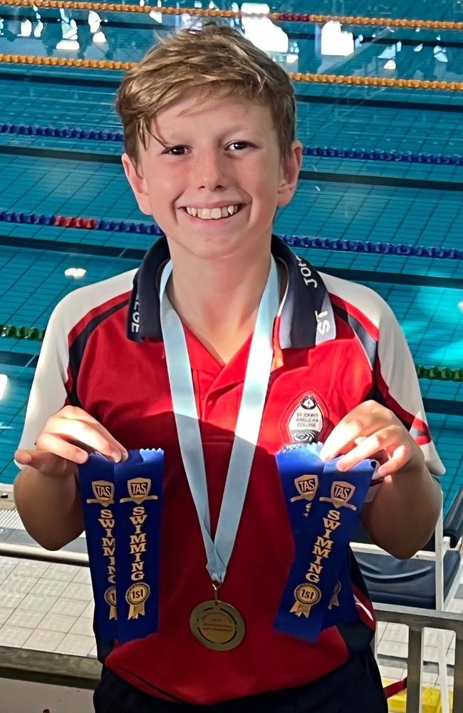 Oliver Theron with ribbons after wins at swimming JTAS.jpg