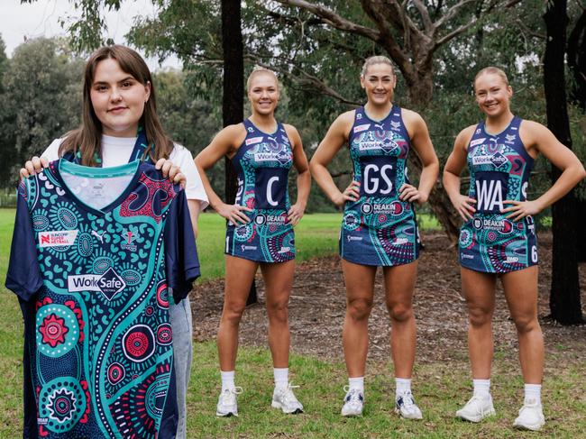 Proud Kamilaroi woman and artist Teagan Malcolm with the dress displaying the imagery she created for the Melbourne Vixens' First Nations round. Picture: Wiradjuri photographer Joshua Scott.