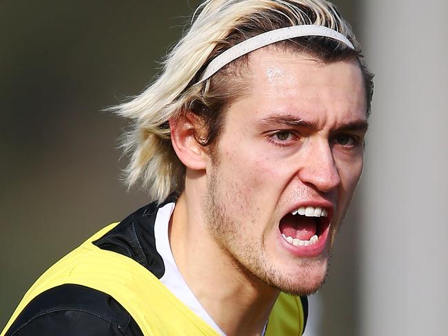 MELBOURNE, AUSTRALIA - JULY 12:  Darcy Moore of the Magpies runs upfield during a Collingwood Magpies AFL training session at the Holden Centre on July 12, 2018 in Melbourne, Australia.  (Photo by Michael Dodge/Getty Images)