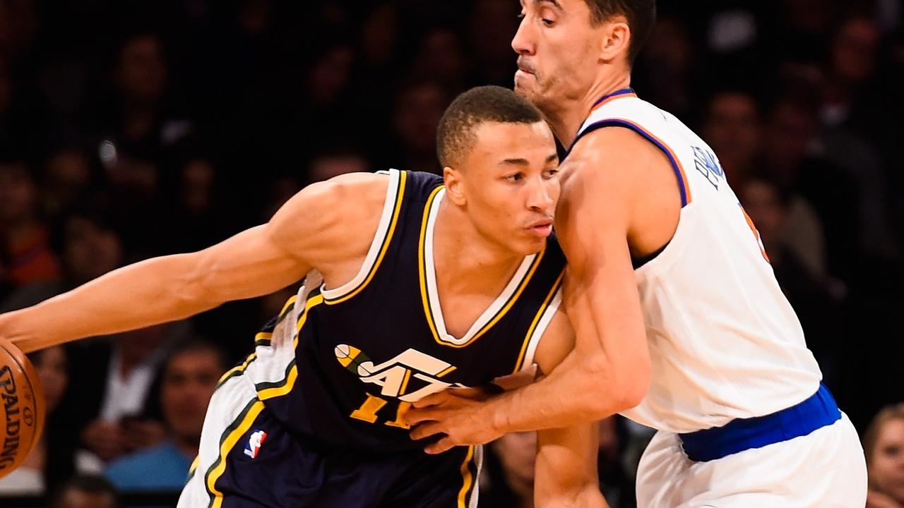 NEW YORK, NY - NOVEMBER 14: Dante Exum #11 of the Utah Jazz attempts to dribble around Pablo Prigioni #9 of the New York Knicks in the first half at Madison Square Garden on November 14, 2014 in New York City. NOTE TO USER: User expressly acknowledges and agrees that, by downloading and/or using this photograph, user is consenting to the terms and conditions of the Getty Images License Agreement. Alex Goodlett/Getty Images/AFP == FOR NEWSPAPERS, INTERNET, TELCOS & TELEVISION USE ONLY ==