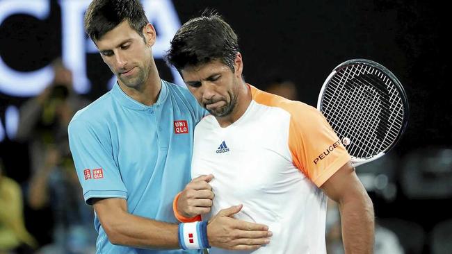 Novak Djokovic (left) of Serbia thanks Fernando Verdasco of Spain after their first-round match at the Australian Open. Picture: MADE NAGI