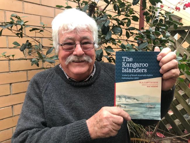 Retired academic Dr Rick Hosking with a copy of <i>The Kangaroo Islanders </i>