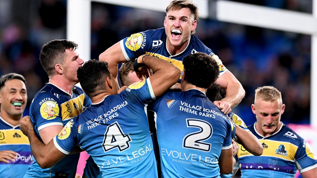 GOLD COAST, AUSTRALIA - AUGUST 14: David Fifita of the Titans is congratulated by teammates after scoring a try during the round 22 NRL match between the Gold Coast Titans and the Manly Sea Eagles at Cbus Super Stadium, on August 14, 2022, in Gold Coast, Australia. (Photo by Bradley Kanaris/Getty Images)