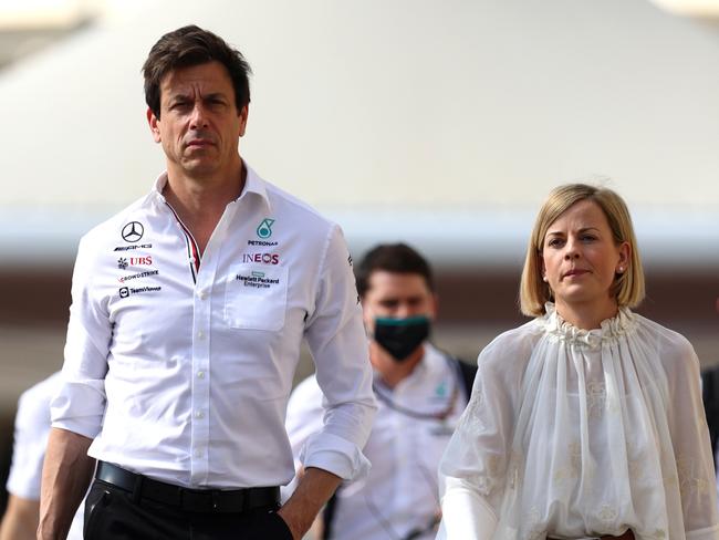 ABU DHABI, UNITED ARAB EMIRATES - DECEMBER 12: Mercedes GP Executive Director Toto Wolff walks in the Paddock with his wife Susie Wolff before the F1 Grand Prix of Abu Dhabi at Yas Marina Circuit on December 12, 2021 in Abu Dhabi, United Arab Emirates. (Photo by Clive Rose/Getty Images)