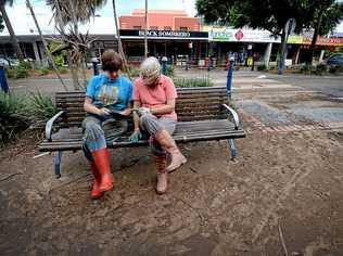 Wendy Wilson and Leanne Beattistuzzi, of Lismore, take a break from cleaning up. Picture: Marc Stapelberg