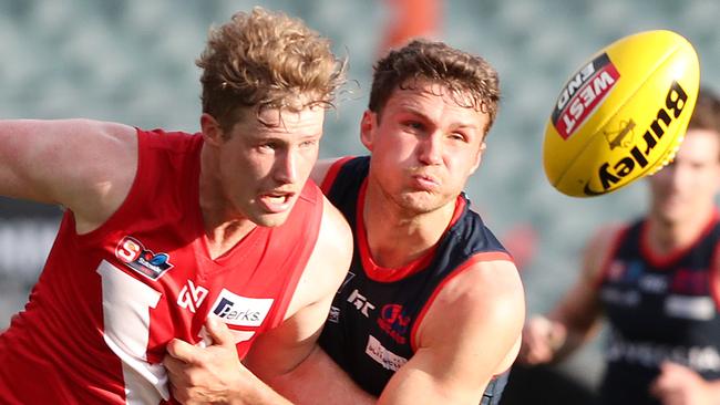 North’s Harrison Wigg fights for front position with Norwood’s Peter Bampton. Picture: Sarah Reed