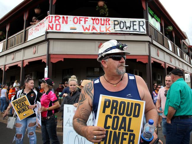 Locals and pro-Adani supporters gather outside the Commercial Hotel to protest against anti-Adani environment activists as they arrive by convoy on April 27, 2019. Picture: Lisa Maree Williams/Getty Images