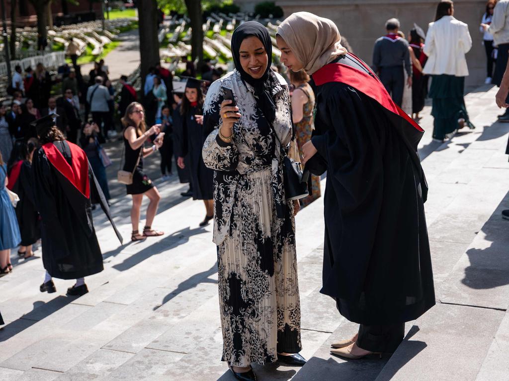 Graduation students pose for pictures in Harvard Yard on May 28, 2025 in Cambridge, Massachusetts. President Trump wants to cut down the number of foreign students which currently account for almost a third of the student body. Picture: Getty Images via AFP