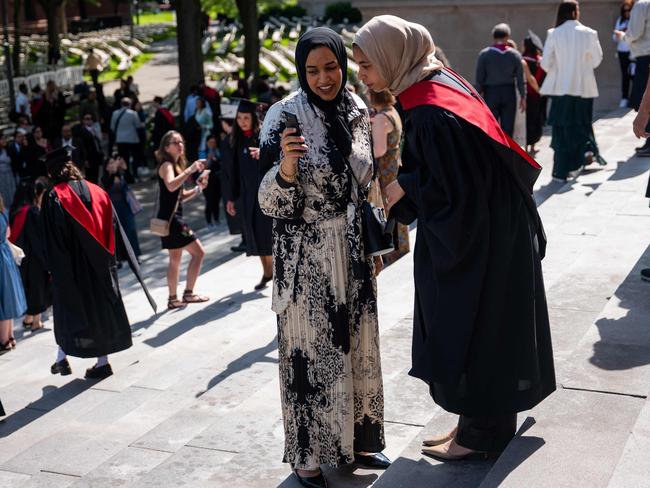 Graduation students pose for pictures in Harvard Yard on May 28, 2025 in Cambridge, Massachusetts. President Trump wants to cut down the number of foreign students which currently account for almost a third of the student body. Picture: Getty Images via AFP