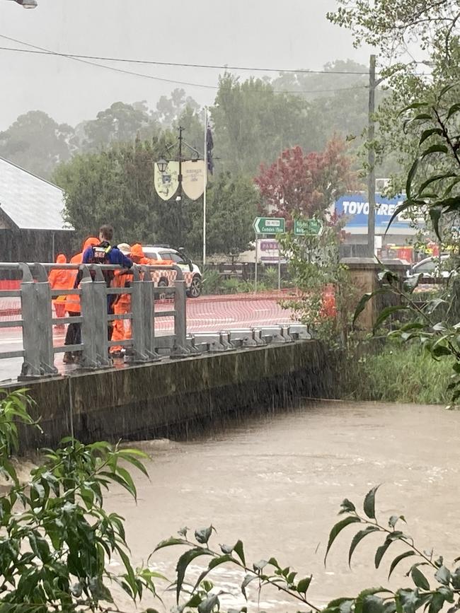 On Wednesday the water was lapping the bridge as local SES units worked to flatten its sides. Picture: Adelaide Lang